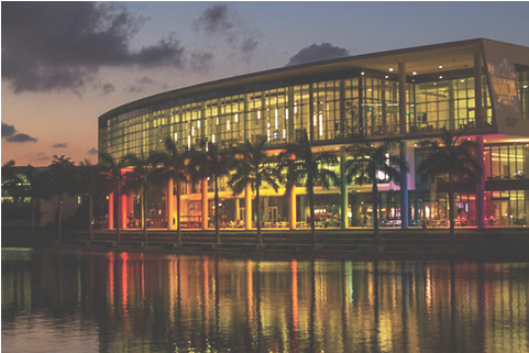 Shalala Student Center lit up by rainbow lights